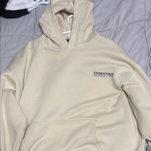 ESSENTIALS Men's Cream Pullover Hoodie with Small Chest Logo